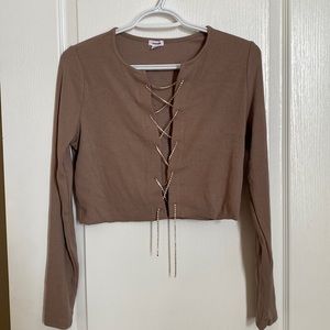 Brown sexy shirt in size medium and a light brown colour